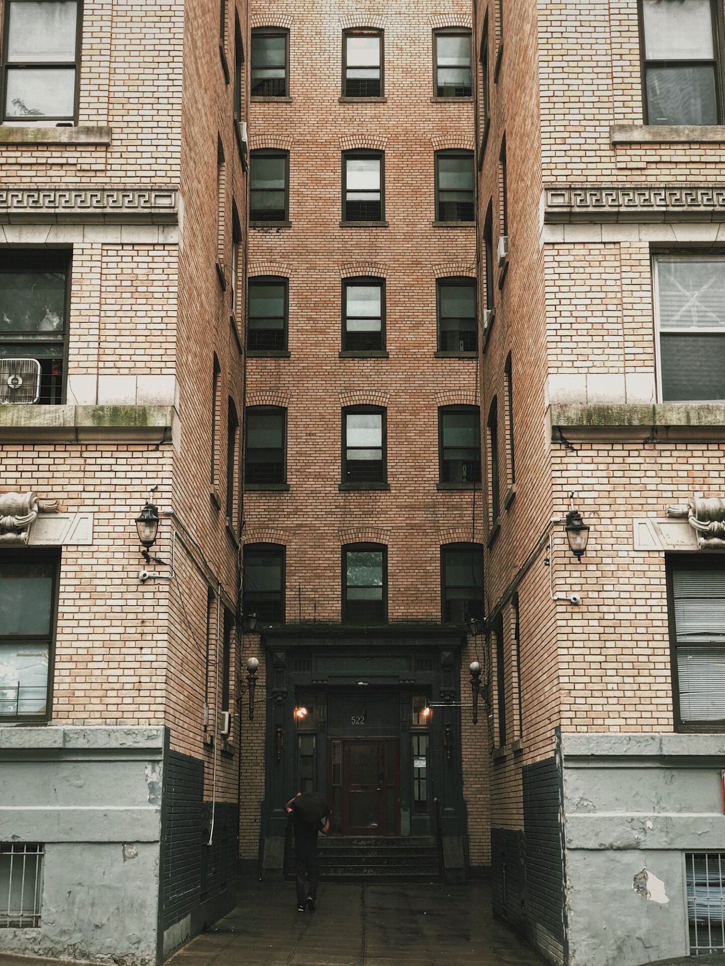 A building with many windows and doors on the outside.